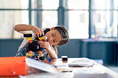 Young girl working on a robot design