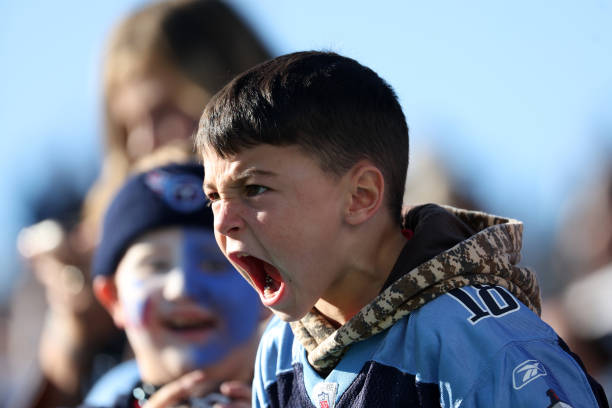 Young Tennessee Titans fan looks on against the Jacksonville Jaguars during the second half at Nissan Stadium on December 12, 2021 in Nashville,...