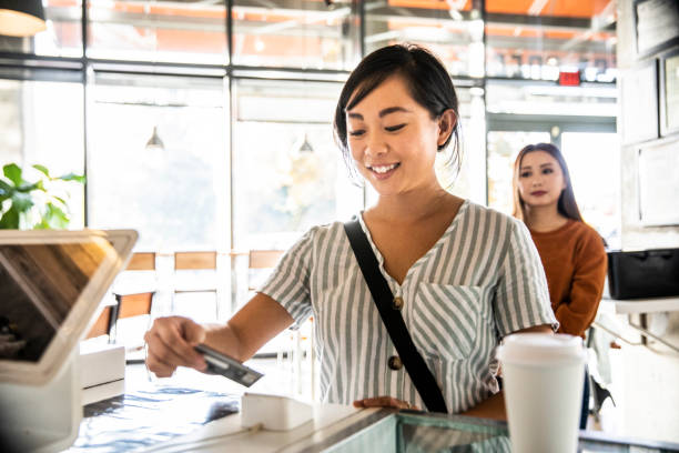 young woman using credit card reader at coffee shop counter picture id1354968156?k=20&m=1354968156&s=612x612&w=0&h=zNcLVVowgNwL7wheWhfRyOQWC TvAVeLAvVEOojRiqw= - Credit Cards, The Benefits, and The Drawbacks