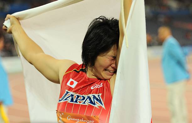 yuki-ebihara-of-japan-cries-as-she-celebrates-with-a-japanese-flag-picture-id107142067