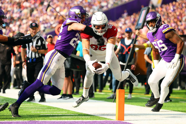 Zach Ertz of the Arizona Cardinals scores a touchdown as Harrison Smith of the Minnesota Vikings defends during the third quarter at U.S. Bank...