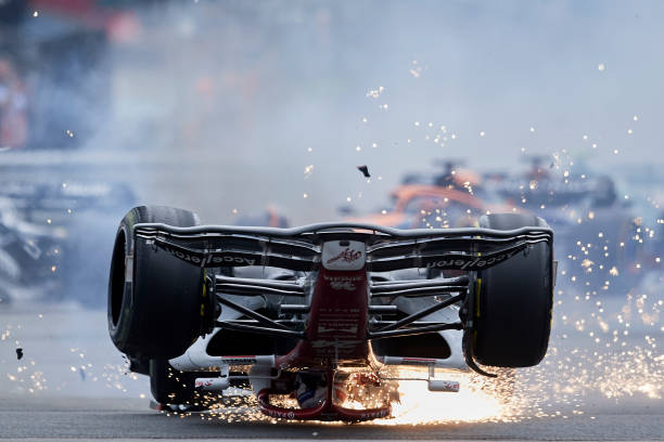 Zhou Guanyu of China Alfa Romeo F1 and George Russell of Great Britain and AMG Petronas F1 crash their cars during the race of the F1 Grand Prix of...