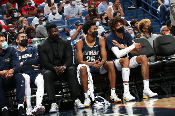 Zion Williamson of the New Orleans Pelicans looks on from the bench during the game against the Philadelphia 76ers on October 20, 2021 at the...