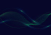 Abstract green wavy lines with dots particles and lighting on dark blue background.