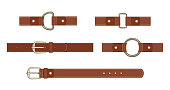 Brown leather belt with buttoned steel buckle, unbuttoned and with different metal haberdashery accessories