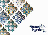 Close-up of colorful ornamental arabic tiles, patterns through white mosque window. Greeting card, invitation for Muslim holiday Ramadan Kareem. Vector illustration bacground, modern web banner.