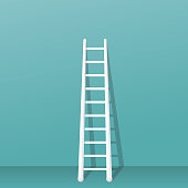 Ladder stands near the wall
