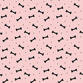 Seamless pattern with bones for dog on the pink background.