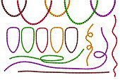 Set Mardi Gras beads isolated on white background.
