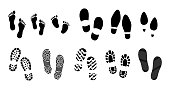 set of black human footprints or human shoe sole or funny footsteps paw.