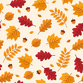 Vector seamless pattern of autumn leaves and acorns.
