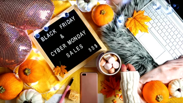 Black Friday and Cyber Monday shopping hygge style Thanksgiving weekend concept.