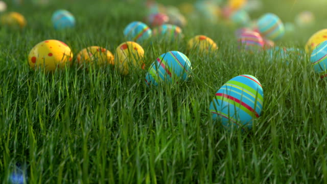 Easter eggs on the grass. Easter eggs slide down the slope covered with green cereal. Sunny positive climate.